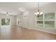 Spacious living room with tile flooring, windows and a ceiling fan at 20221 Vintage Oaks Pl, Tampa, FL 33647