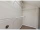Walk-in closet with adjustable white wire shelving and neutral carpeting at 20221 Vintage Oaks Pl, Tampa, FL 33647