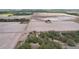 Scenic aerial view showcasing a rural homesite surrounded by agricultural fields and natural landscape at 20413 Keene Rd, Wimauma, FL 33598