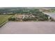 Aerial view of a expansive rural property with a home near a large field at 20413 Keene Rd, Wimauma, FL 33598