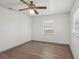 A bedroom featuring two windows and ceiling fan at 20413 Keene Rd, Wimauma, FL 33598