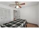 Bedroom with a ceiling fan, closet, and doorway with access to other areas at 20413 Keene Rd, Wimauma, FL 33598