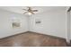 This bedroom features two windows, and a ceiling fan at 20413 Keene Rd, Wimauma, FL 33598
