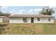 Charming single-story home with a simple landscape and neutral color, creating a cozy curb appeal at 20413 Keene Rd, Wimauma, FL 33598