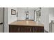 Living area featuring a breakfast bar, with doorway access to the outside at 20413 Keene Rd, Wimauma, FL 33598