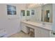 Bright bathroom featuring double sinks, a large mirror, and ample counter space at 2216 W Del Webb Blvd, Sun City Center, FL 33573
