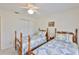 Bedroom featuring twin beds with matching quilts and closets at 2216 W Del Webb Blvd, Sun City Center, FL 33573
