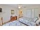 Bedroom featuring twin beds with quilts and large closet at 2216 W Del Webb Blvd, Sun City Center, FL 33573