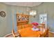 Cozy dining room featuring a wooden table, chairs, and a vintage hutch at 2216 W Del Webb Blvd, Sun City Center, FL 33573