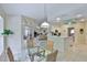 Open floor plan with kitchen leading to a casual dining area and living room at 2216 W Del Webb Blvd, Sun City Center, FL 33573