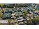 Aerial view of a tennis facility featuring multiple courts, perfect for enthusiasts and community events at 2216 W Del Webb Blvd, Sun City Center, FL 33573