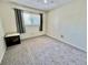 Cozy bedroom featuring natural light, neutral walls and carpet, and ample space at 2457 Ecuadorian Way # 57, Clearwater, FL 33763