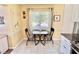 Charming breakfast nook with a bistro set, bright natural light, and stylish decor at 2457 Ecuadorian Way # 57, Clearwater, FL 33763