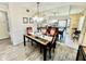 Bright dining room with chandelier lighting and a mirrored wall at 2457 Ecuadorian Way # 57, Clearwater, FL 33763