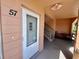 Entrance to unit 57 with a door and staircase to other units at 2457 Ecuadorian Way # 57, Clearwater, FL 33763