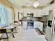 Bright kitchen featuring stainless steel appliances and an adjacent breakfast nook at 2457 Ecuadorian Way # 57, Clearwater, FL 33763