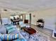 Bright living room with stylish decor, comfortable seating, and views into the dining area at 2457 Ecuadorian Way # 57, Clearwater, FL 33763