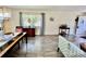 Living room and dining space with ample natural light and wood flooring at 2457 Ecuadorian Way # 57, Clearwater, FL 33763