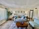 Comfortable living room with neutral tones, decor, and wood flooring at 2457 Ecuadorian Way # 57, Clearwater, FL 33763