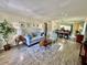 Inviting living room with wood flooring and dining area at 2457 Ecuadorian Way # 57, Clearwater, FL 33763