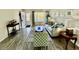 Open-concept living room with wood floors and plenty of natural light at 2457 Ecuadorian Way # 57, Clearwater, FL 33763