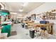 Spacious workshop with ample lighting, workbenches, and organized tool storage at 2457 Ecuadorian Way # 57, Clearwater, FL 33763