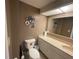 Neutral bathroom with decorative wall plates and vanity with solid surface counters and integrated sink at 2615 Cove Cay Dr # 408, Clearwater, FL 33760