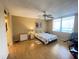 Bright bedroom features a ceiling fan, large window, and neutral walls at 2615 Cove Cay Dr # 408, Clearwater, FL 33760