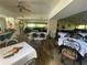 An airy dining room featuring multiple tables, chairs, and a bar area at 2615 Cove Cay Dr # 408, Clearwater, FL 33760