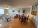 Open-concept living and dining area with hardwood floors, ceiling fan, and modern decor at 2615 Cove Cay Dr # 408, Clearwater, FL 33760