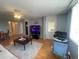 Open living room area with tile flooring, a ceiling fan, and an adjacent outdoor patio at 2615 Cove Cay Dr # 408, Clearwater, FL 33760