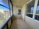 Enclosed porch with tile flooring, windows and sliding glass door to enjoy views and outdoor living at 2615 Cove Cay Dr # 408, Clearwater, FL 33760