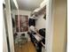 Organized walk-in closet with shelving, mirrored door, and ample storage space for clothing and accessories at 2615 Cove Cay Dr # 408, Clearwater, FL 33760