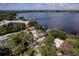 Panoramic aerial shot showcasing waterfront homes with docks, lush vegetation, and serene lake views at 297 Lakeview Dr, Tarpon Springs, FL 34689