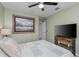 Relaxing bedroom with a ceiling fan, soft lighting, and a view of the hallway at 297 Lakeview Dr, Tarpon Springs, FL 34689