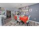 Cozy dining room featuring colorful decor and a modern chandelier, creating an inviting atmosphere at 297 Lakeview Dr, Tarpon Springs, FL 34689