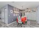 Charming dining room with floral chairs, bright artwork, and built-in cabinets, perfect for Gathering gatherings at 297 Lakeview Dr, Tarpon Springs, FL 34689