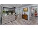 Comfortable living space with wood-look floors, natural light, and stylish furnishings throughout at 297 Lakeview Dr, Tarpon Springs, FL 34689
