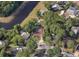 A home sits in a serene neighborhood nestled among mature trees, offering a sense of privacy and tranquility at 3079 Osprey Ln, Clearwater, FL 33762