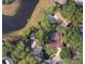 A home sits in a serene neighborhood nestled among mature trees, offering a sense of privacy and tranquility at 3079 Osprey Ln, Clearwater, FL 33762