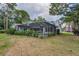 A spacious backyard with a screened-in pool, perfect for outdoor activities and entertaining guests at 3079 Osprey Ln, Clearwater, FL 33762