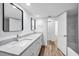 Bright bathroom with double sinks, granite countertops and walk in shower at 3079 Osprey Ln, Clearwater, FL 33762