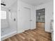 Modern bathroom with a walk-in shower and access to the main bedroom at 3079 Osprey Ln, Clearwater, FL 33762