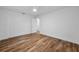 Bright bedroom features wood-look flooring, white trim, and a ceiling fan at 3079 Osprey Ln, Clearwater, FL 33762