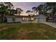 Charming single-story home featuring a well-manicured lawn and attached two car garage at 3079 Osprey Ln, Clearwater, FL 33762
