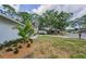 A well-manicured front yard with lush landscaping, enhancing the curb appeal of the property and neighborhood at 3079 Osprey Ln, Clearwater, FL 33762