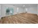 Open layout living room offers access to various areas of the home and has large format tile floors at 3079 Osprey Ln, Clearwater, FL 33762