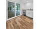 Bright living room with bar area and seamless access to outdoor pool area through sliding glass doors at 3079 Osprey Ln, Clearwater, FL 33762