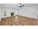 Bright living room featuring a fireplace, recessed lighting, and ample windows for natural light at 3079 Osprey Ln, Clearwater, FL 33762