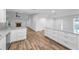 Open concept living room, kitchen and dining room boasting neutral colors and modern design at 3079 Osprey Ln, Clearwater, FL 33762